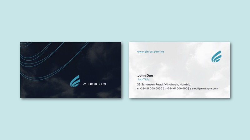 Cirrus business cards: a dark card with the logo and curved line work, and a white card with contact details.